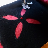 Machine sewing the edges so that I don't snag the holes on accident.